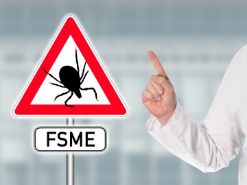 Achtung-Schild FSME, Arzt mit erhobenem Zeigefinger warnt