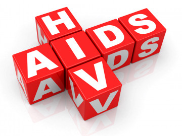 Mit roten Würfeln gelegte Worte HIV und AIDS