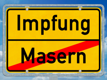 Ortsschild mit Aufschrift Impfung/Masern