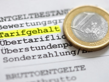 Tarifgehalt und 1-Euro-Münze
