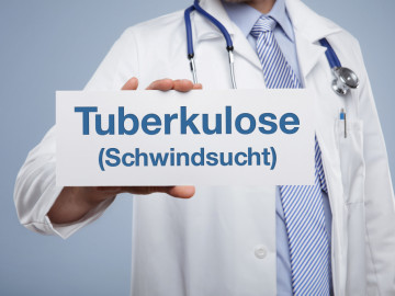 Arzt hält Schild mit Aufschrift Tuberkulose (Schwindsucht) in der Hand