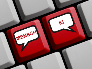 Tastatur mit zwei roten Tasten „Mensch“ und „KI“