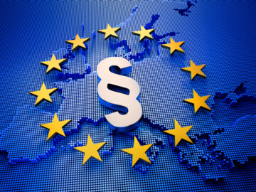 Paragraphensymbol liegt über Europa umgeben von gelben Sternen